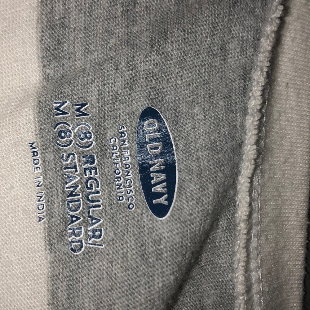 A kid’s gray and white long sleeve shirt Old Navy